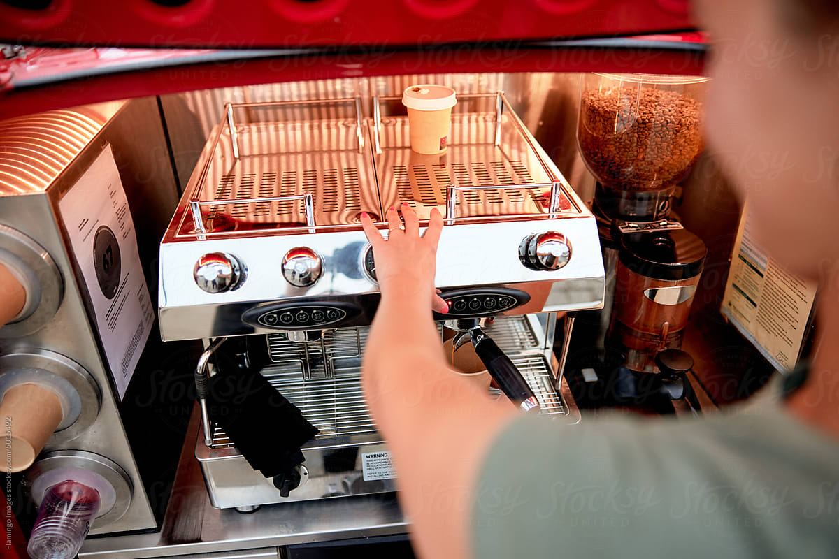 Barista preparing coffee at a cafe truck