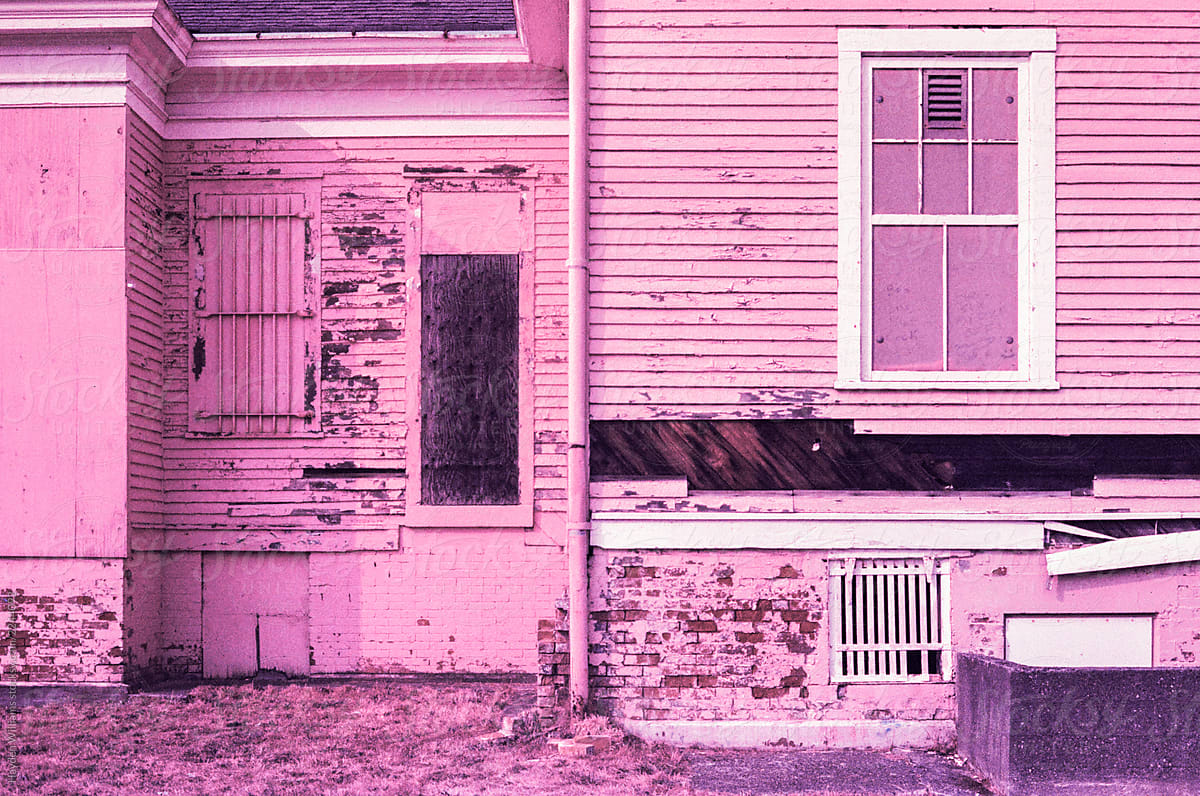 Side of abandoned pink house