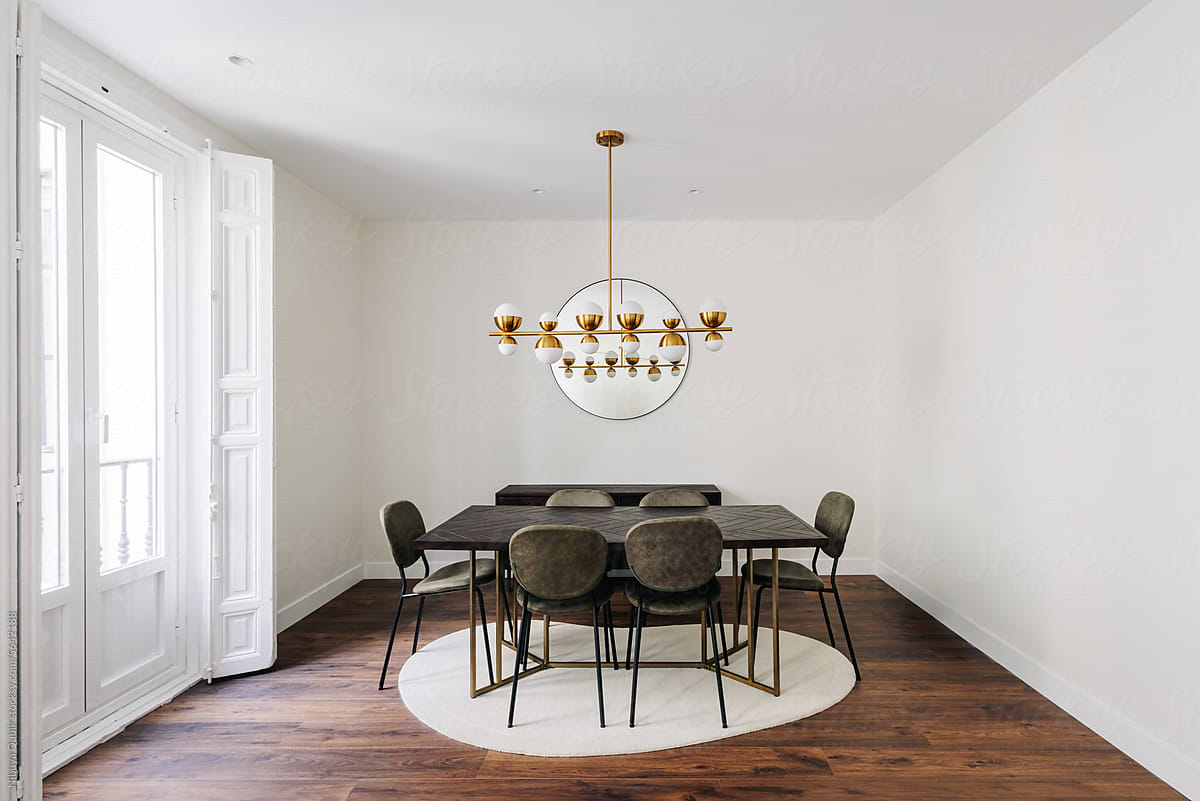 Solid wood dining table with six chairs and elegantly designed lamp
