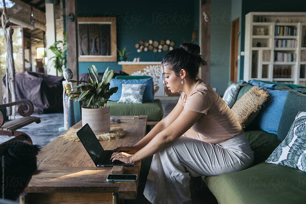 Focused woman working on laptop