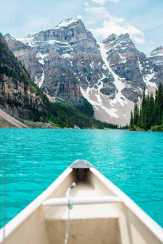 First person view canoeing through clear blue water by 