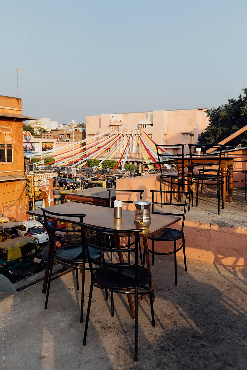 Chairs and tables on the roof make up a rooftop restaurant