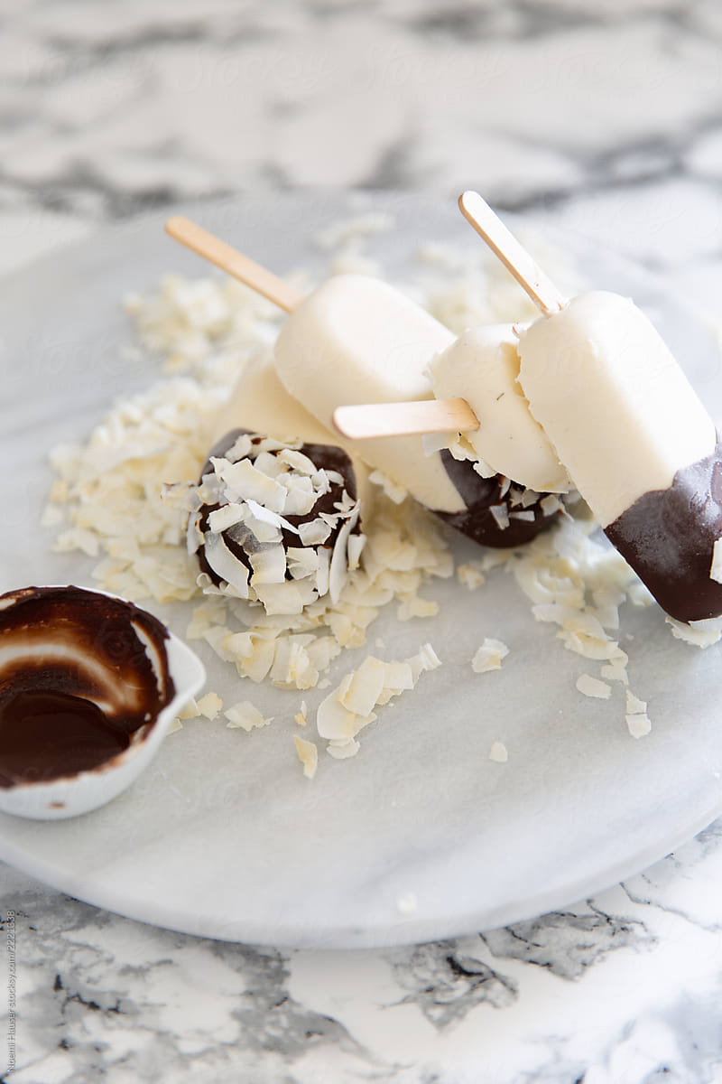 Coconut ice cream coated with chocolate and coconut flakes
