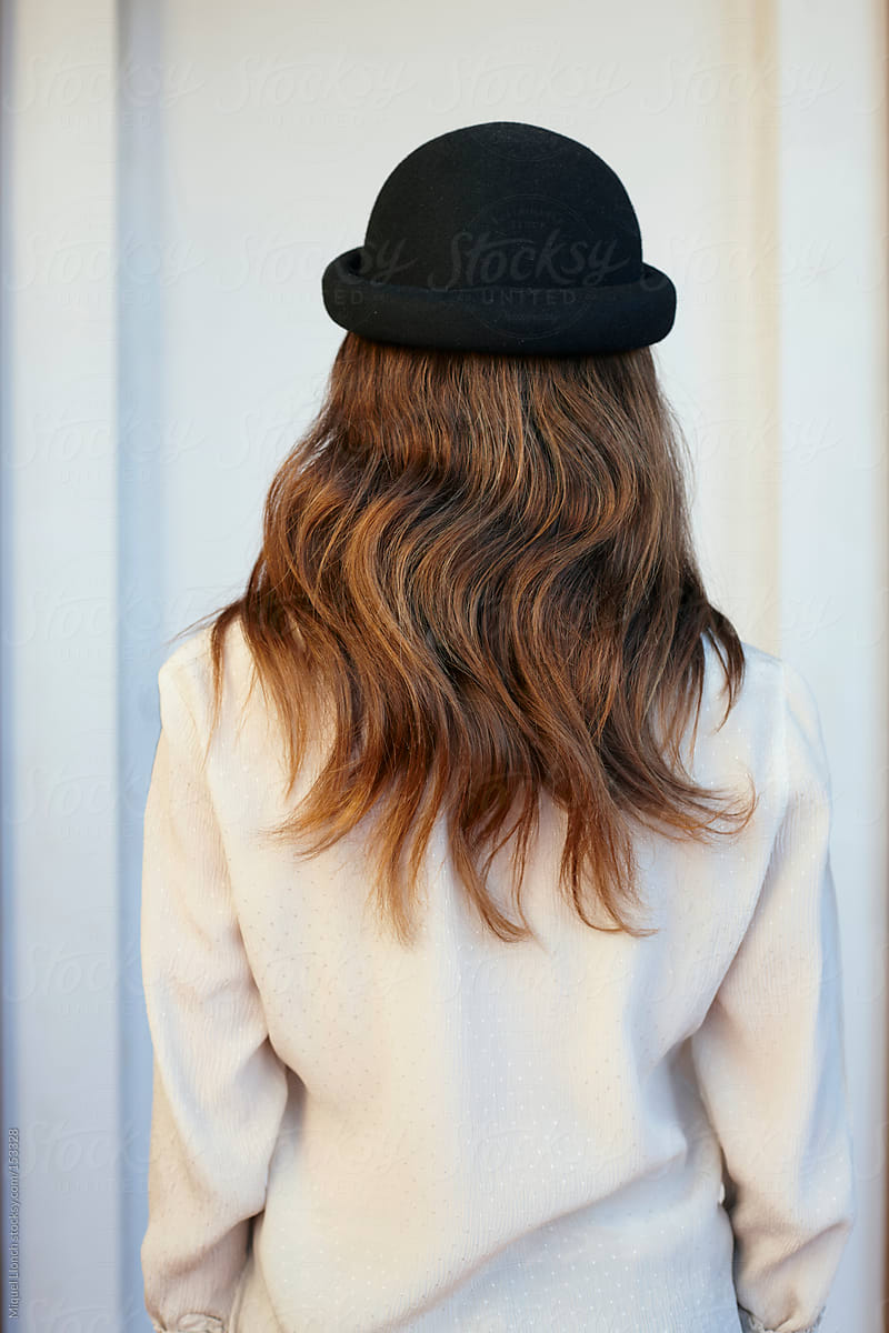 Fashion back portrait of anonymous young woman with long  hair