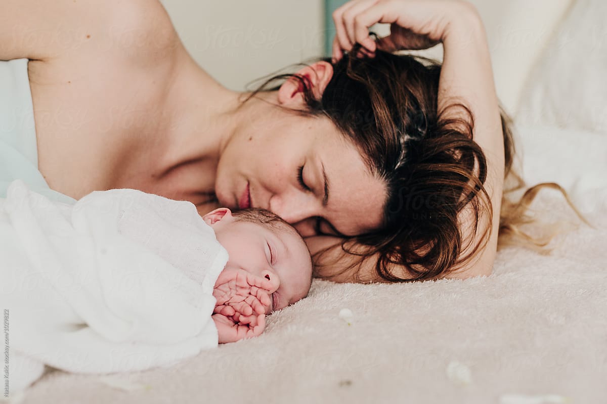 Mother And Baby Cuddling On Bed By Stocksy Contributor Natasa Kukic