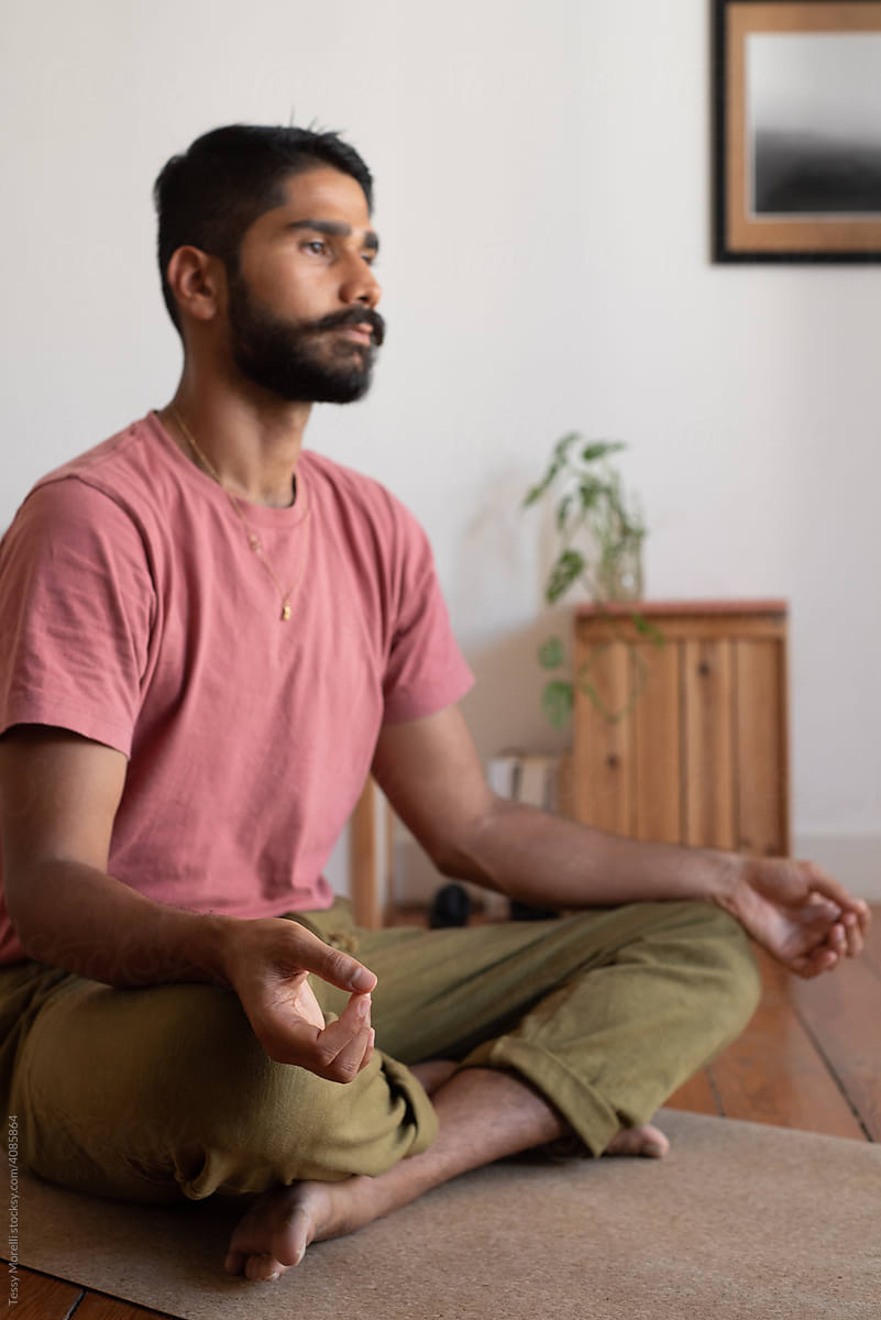 Lotus position for a man practising pranayama at home