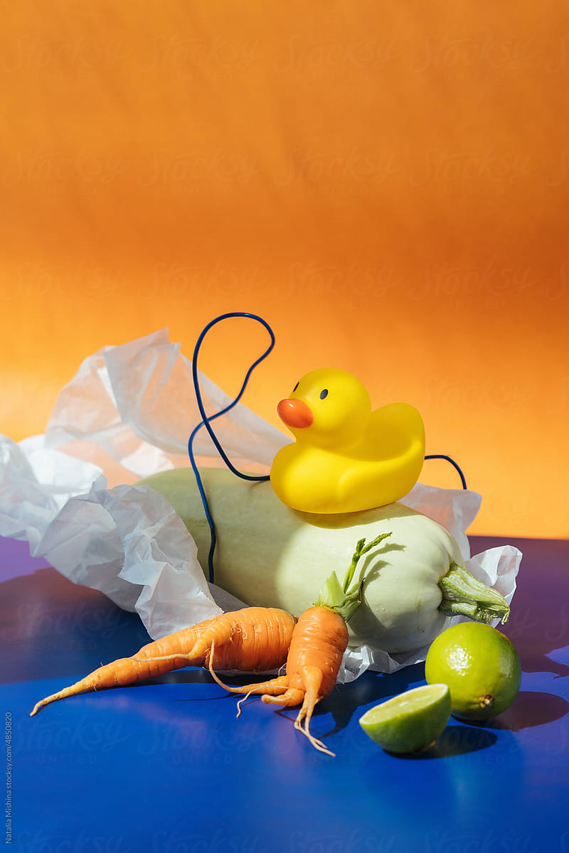 Conceptual still life with carrot, zucchini and rubber duck.