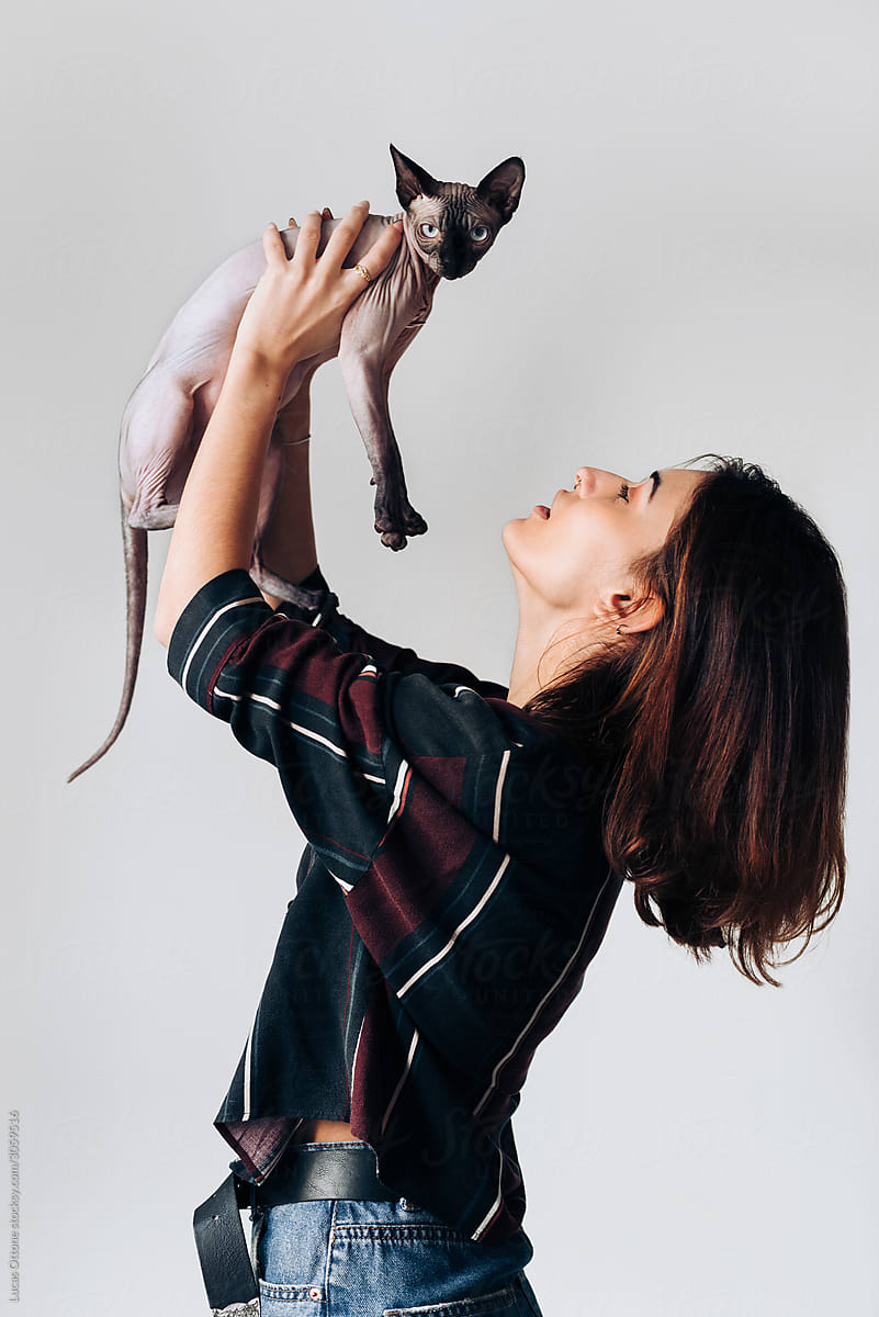 Woman with her Sphynx cat