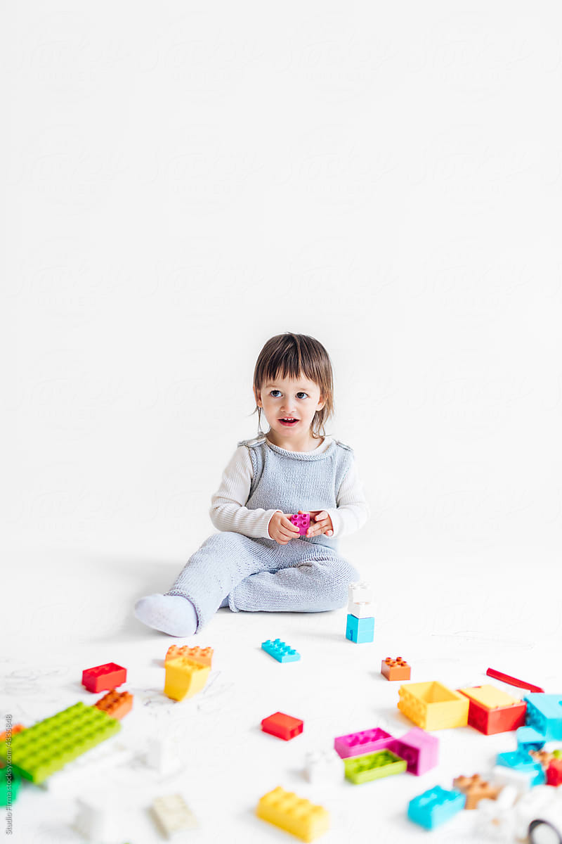 Little Girl Playing with Cubes