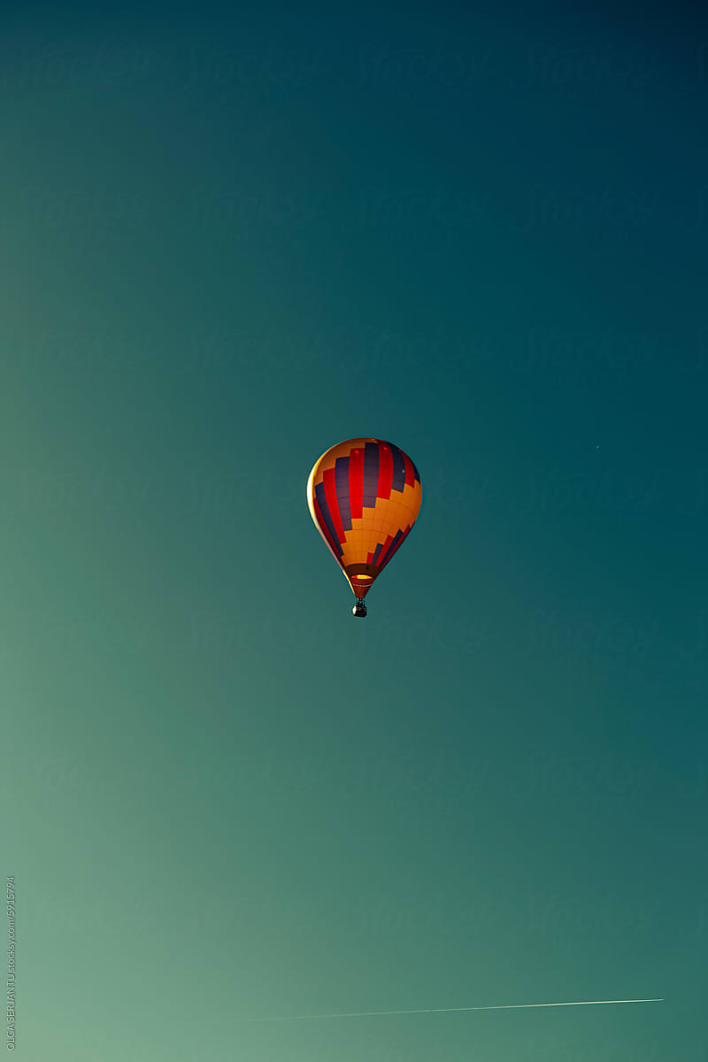 Hot air balloon on a colorful sky