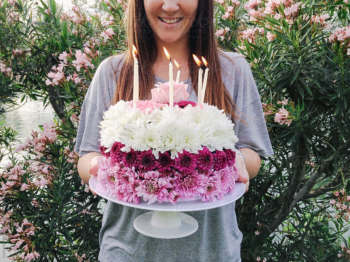 Girl holding flower cake