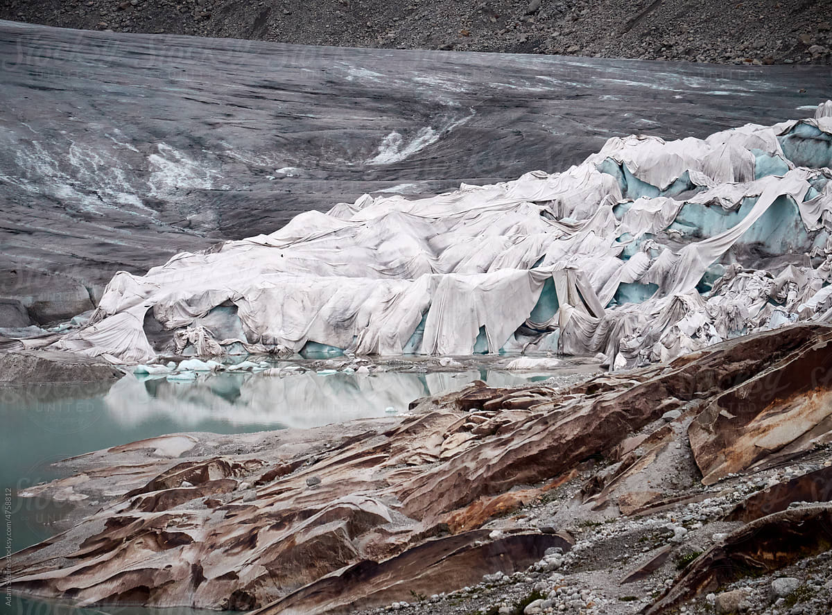 Climate change thawing Rhone glacier in European Alps, thermal blanket