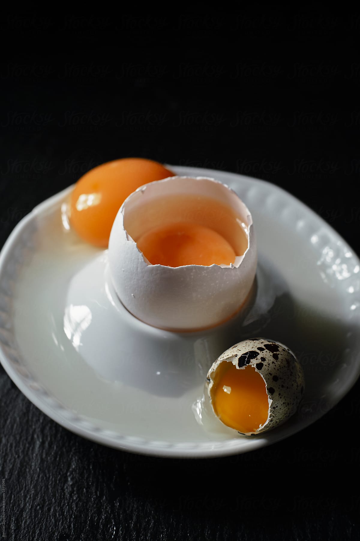 Small bowl with cracked eggs