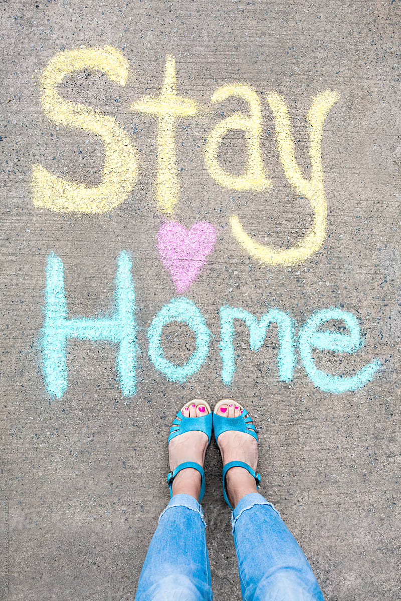 Chalk message saying Stay Home