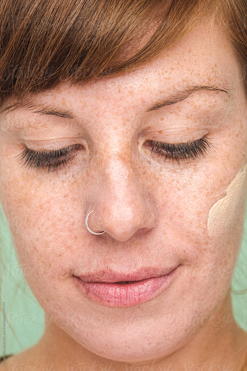 Ginger Woman With Foundation Spread On Her Face