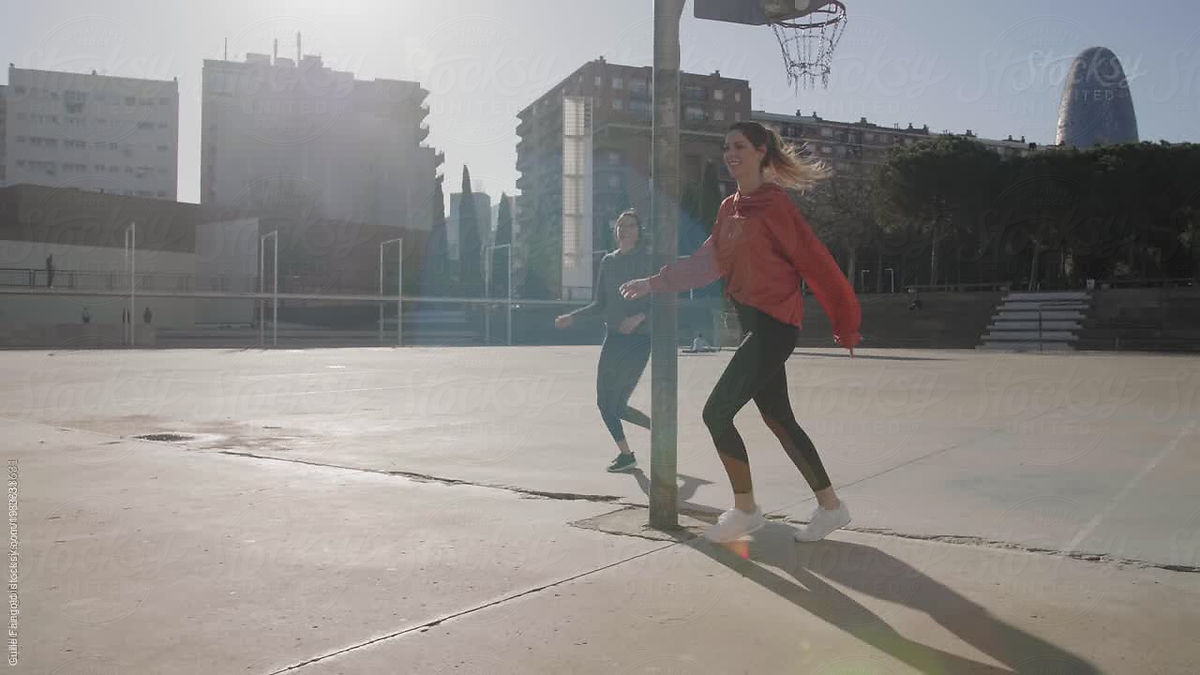 Sportive Girls In Sportswear Running On Sunlit Stadium By Stocksy Contributor Guille