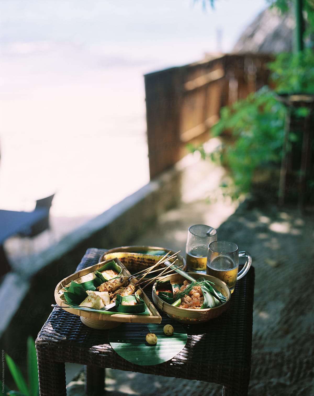 Southeast Asian foods are on the table. In the pleasant time by the beach. shot by 120 films