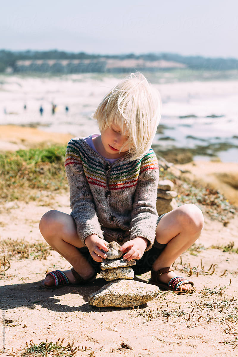 Cute Girl Placing A Stone On A Cairn By Jess Lewis 