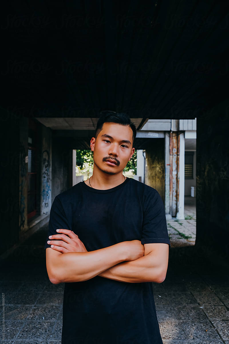Portrait of Handsome Chinese Man With Dark Background