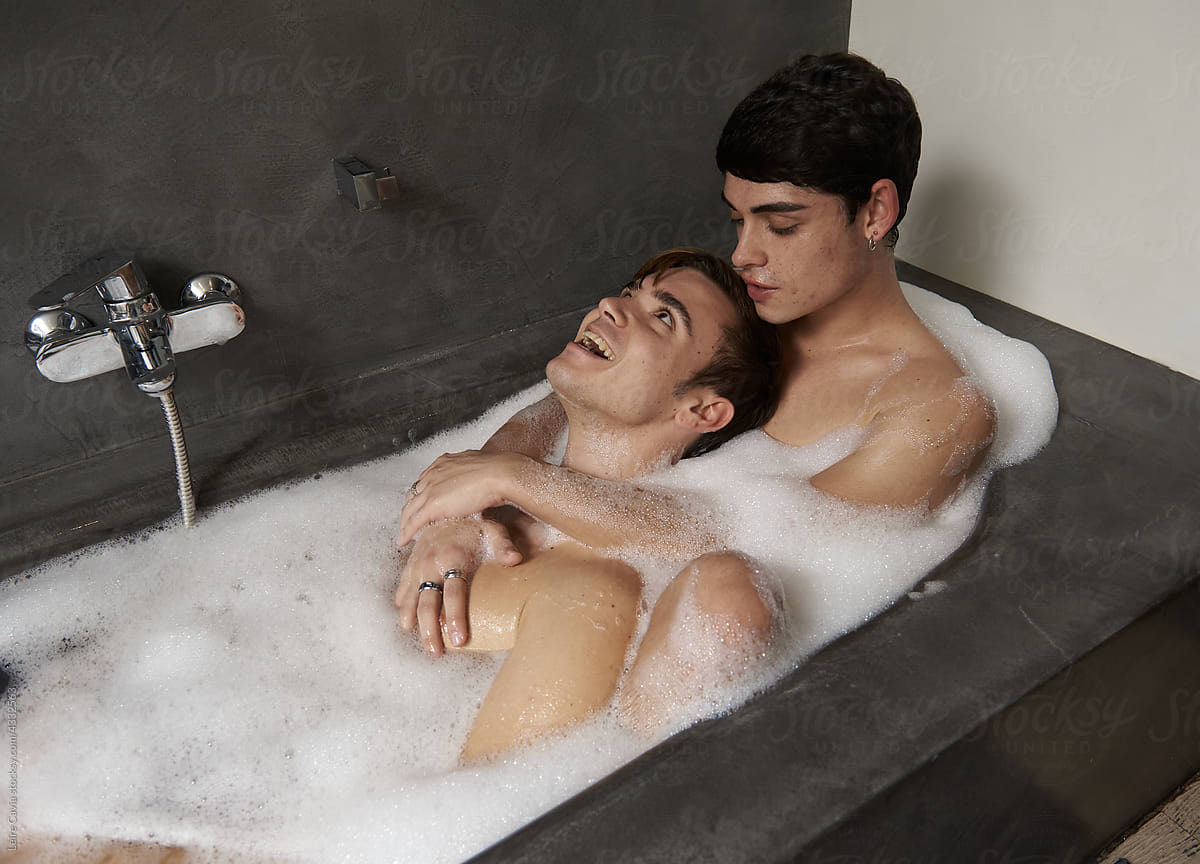 Gay couple  having fun bathing together