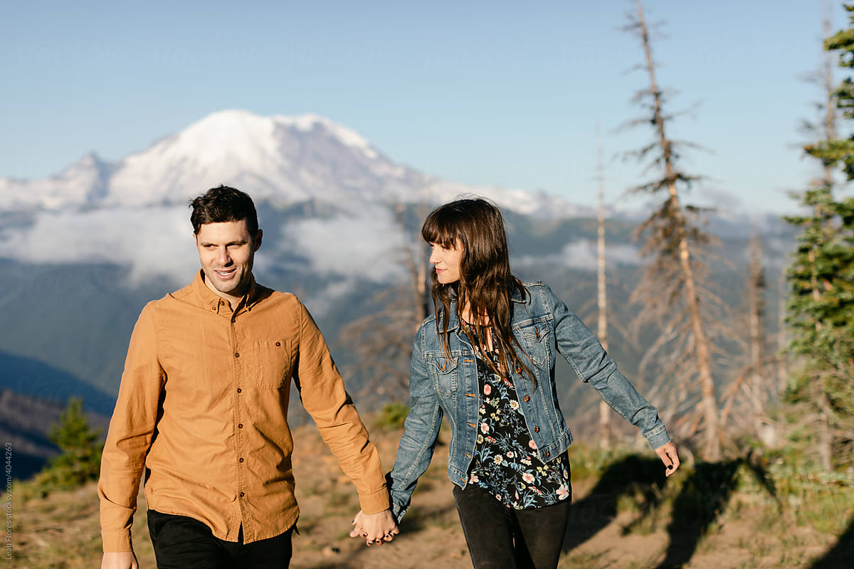 Couple Walking in front of Mountain