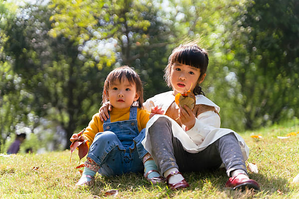 Lovely Chinese Toddler Girl In White Skirt by Stocksy Contributor Bo Bo  - Stocksy