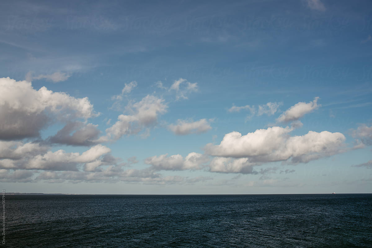 Cloudy sky over rippling sea