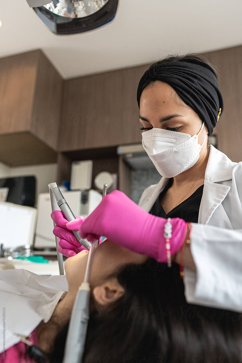 Dentist treating  patient