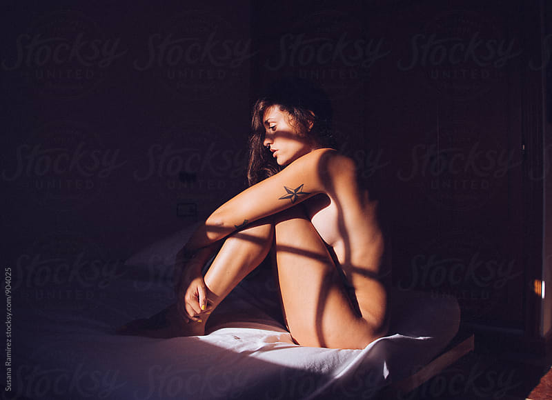 Naked woman with shadows