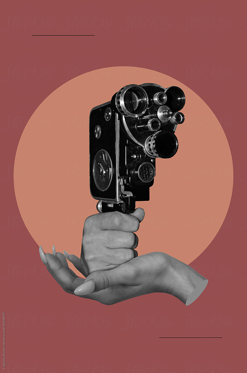 Female hand holding male hand with old movie camera
