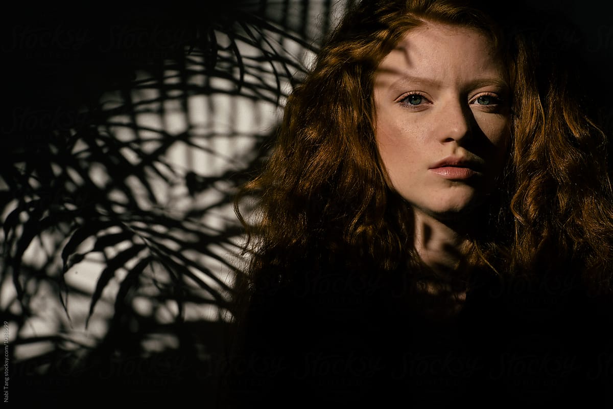 Beautiful Ginger Girl Portrait With Palm Tree Shadow On Her Face By