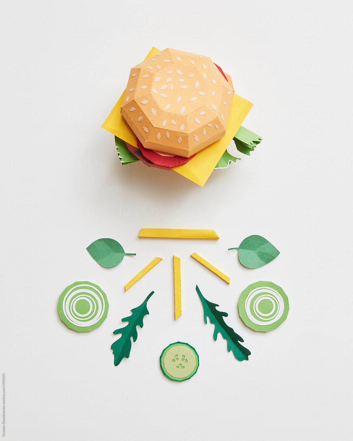 Paper craft ingredients for cooking green salad, French fries and burger on white background
