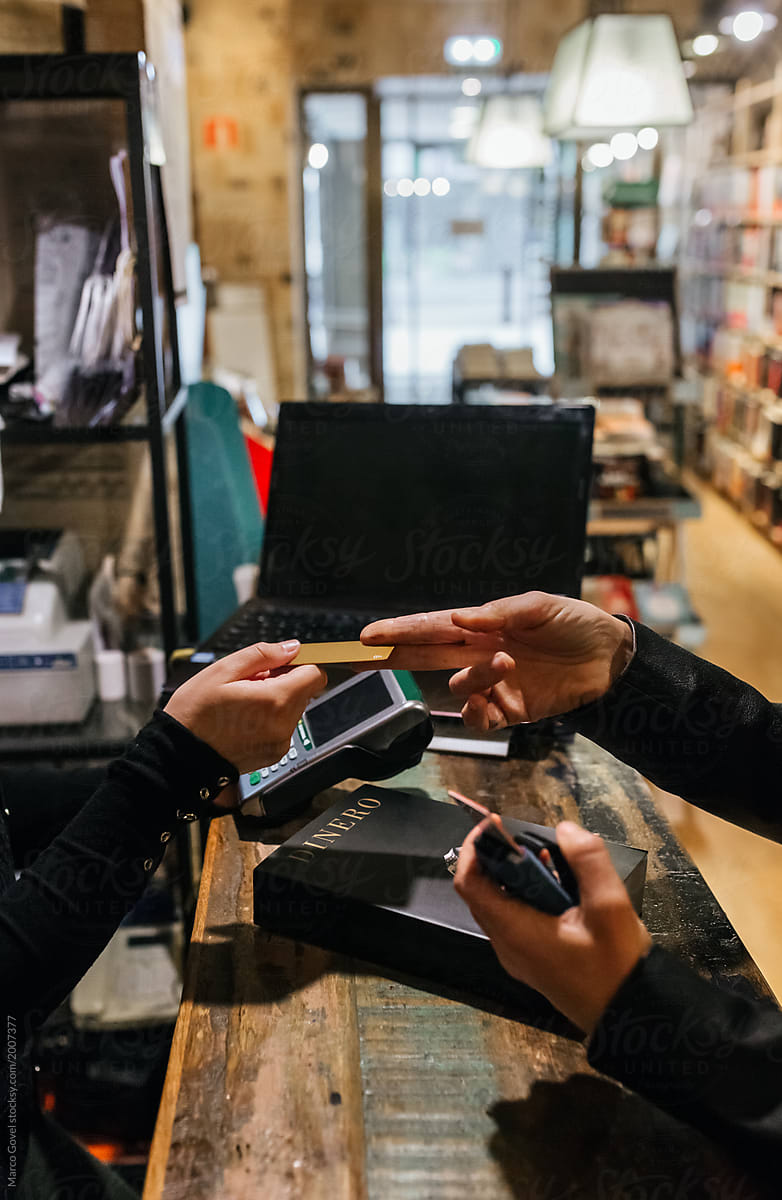Woman paying in a store with credit card