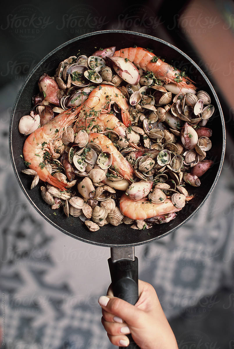 Top view of a pan with fried seafood
