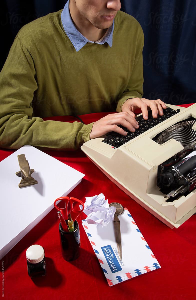 Office worker typing on typewriter