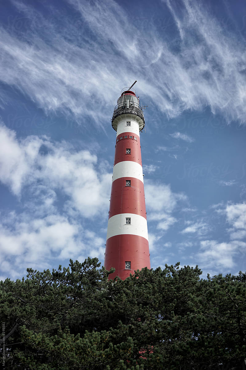 Lighthouse beacon against blue sky