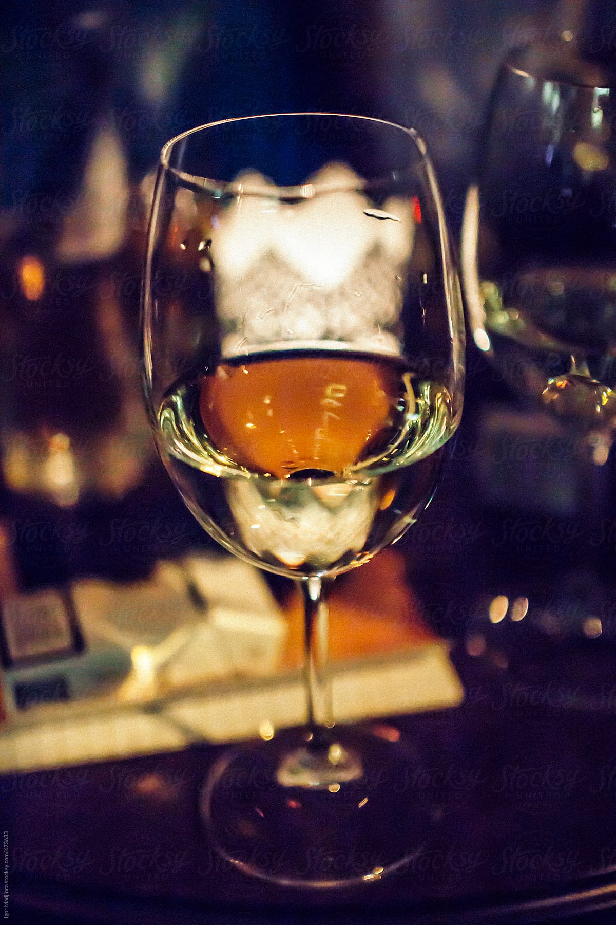 a glass of wine in a nightclub