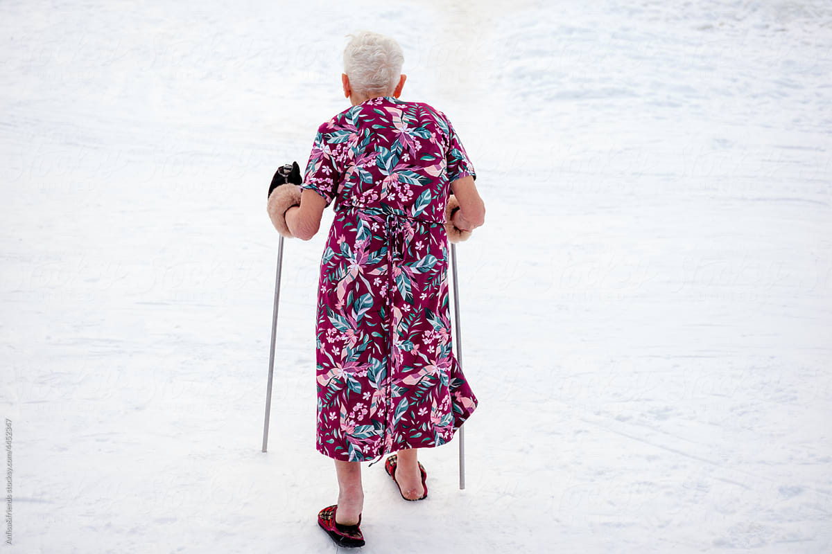 mature woman walking in the snow
