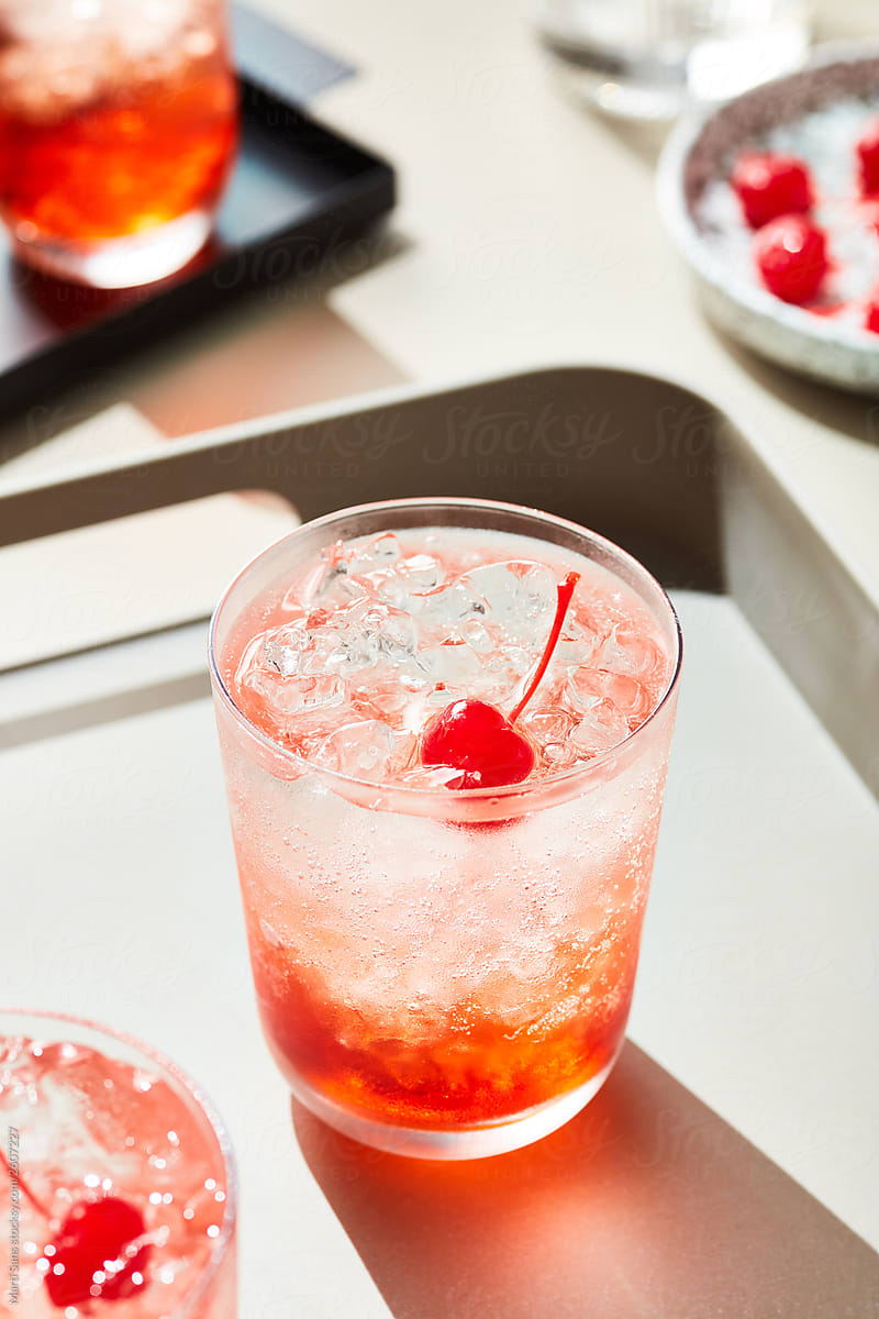 Sweet non-alcoholic drink mocktail with cherry