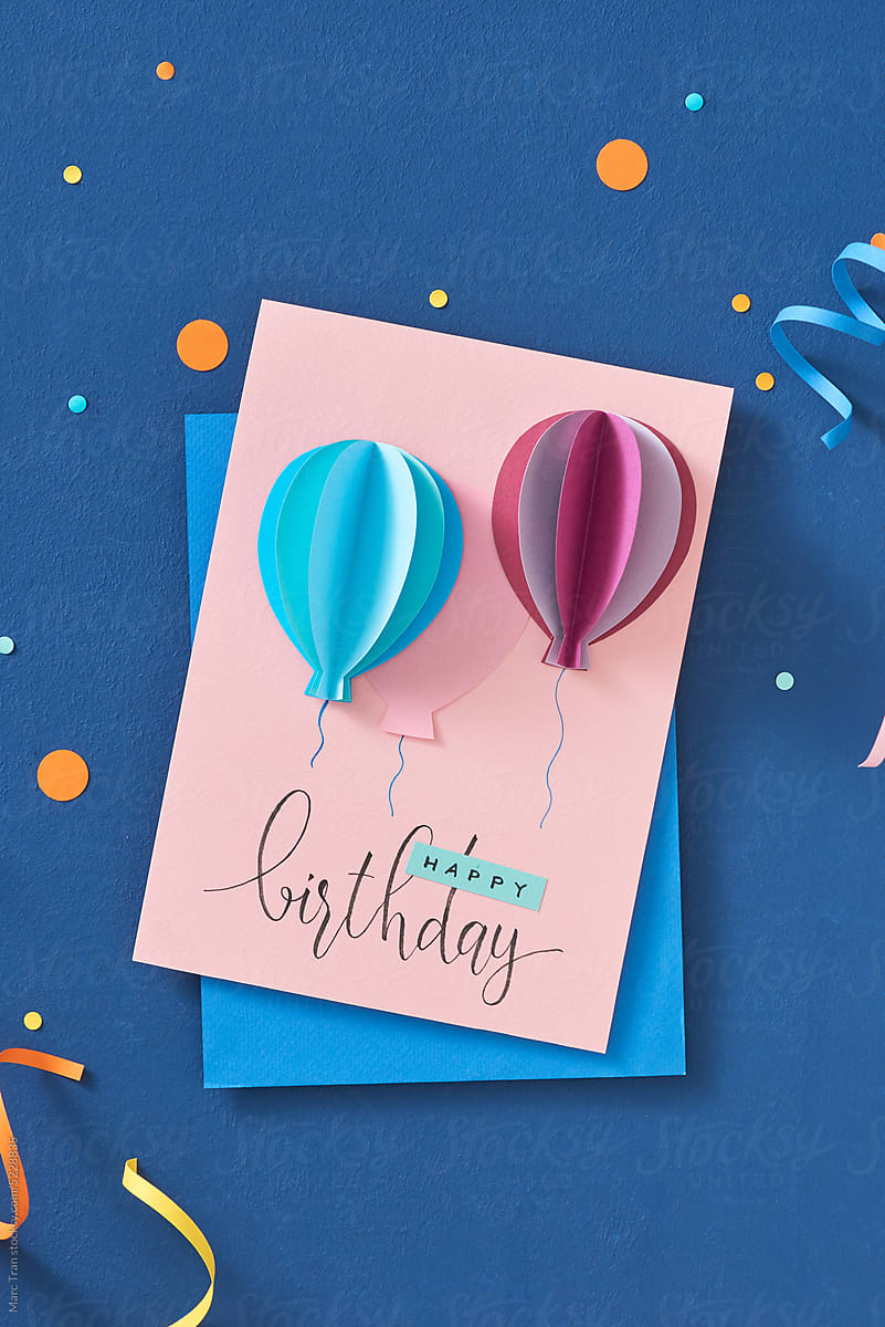 Greeting card with air balloons congratulation on a blue backgro