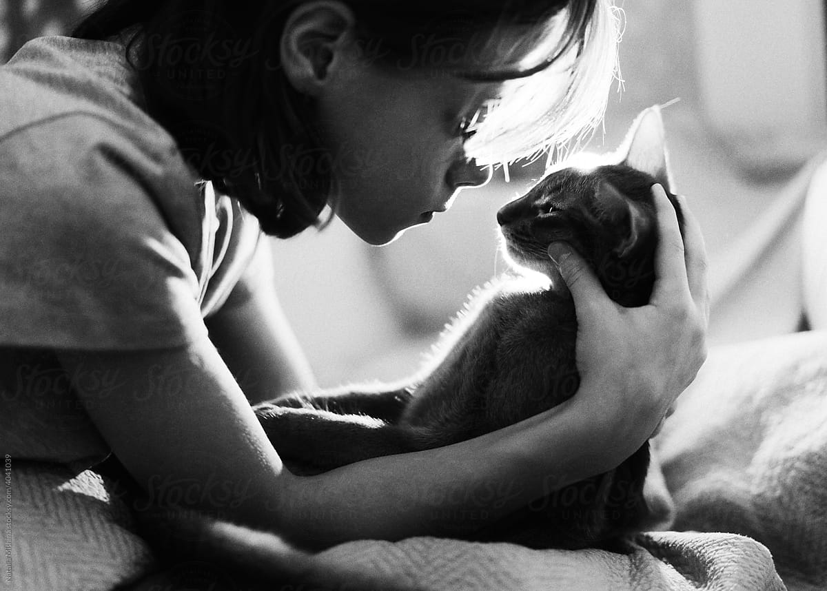 A girl with a cat.