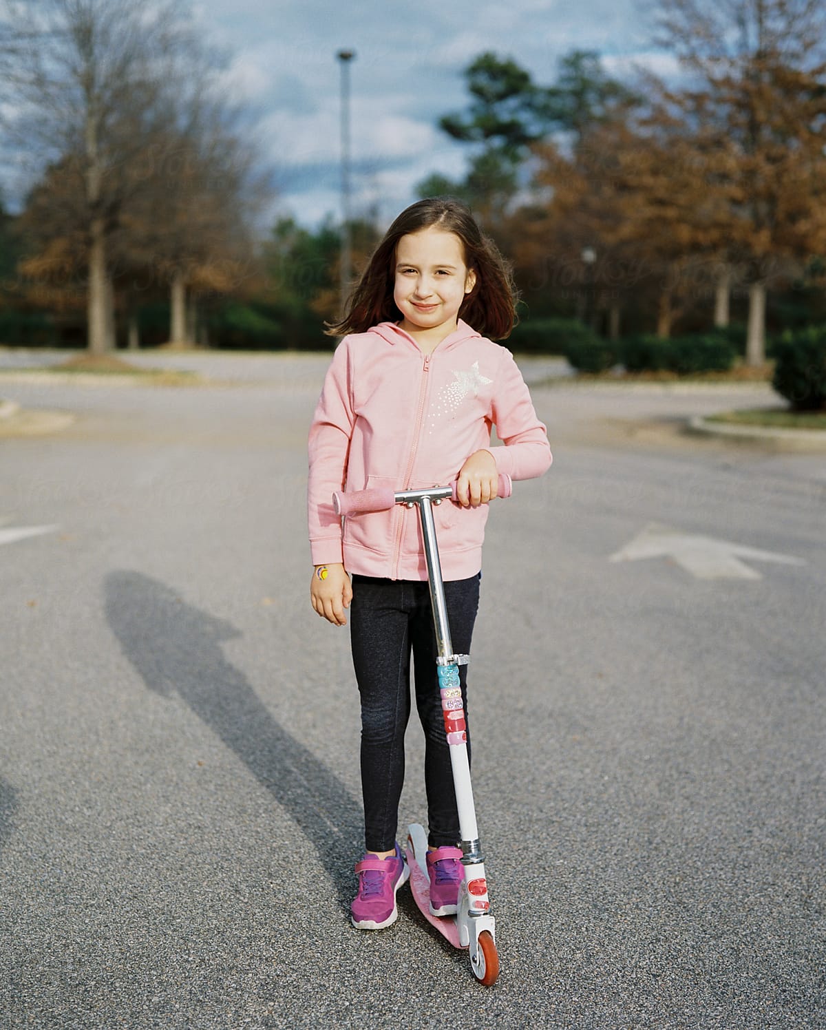 Cute Young Girl With A Scooter By Stocksy Contributor Jakob 