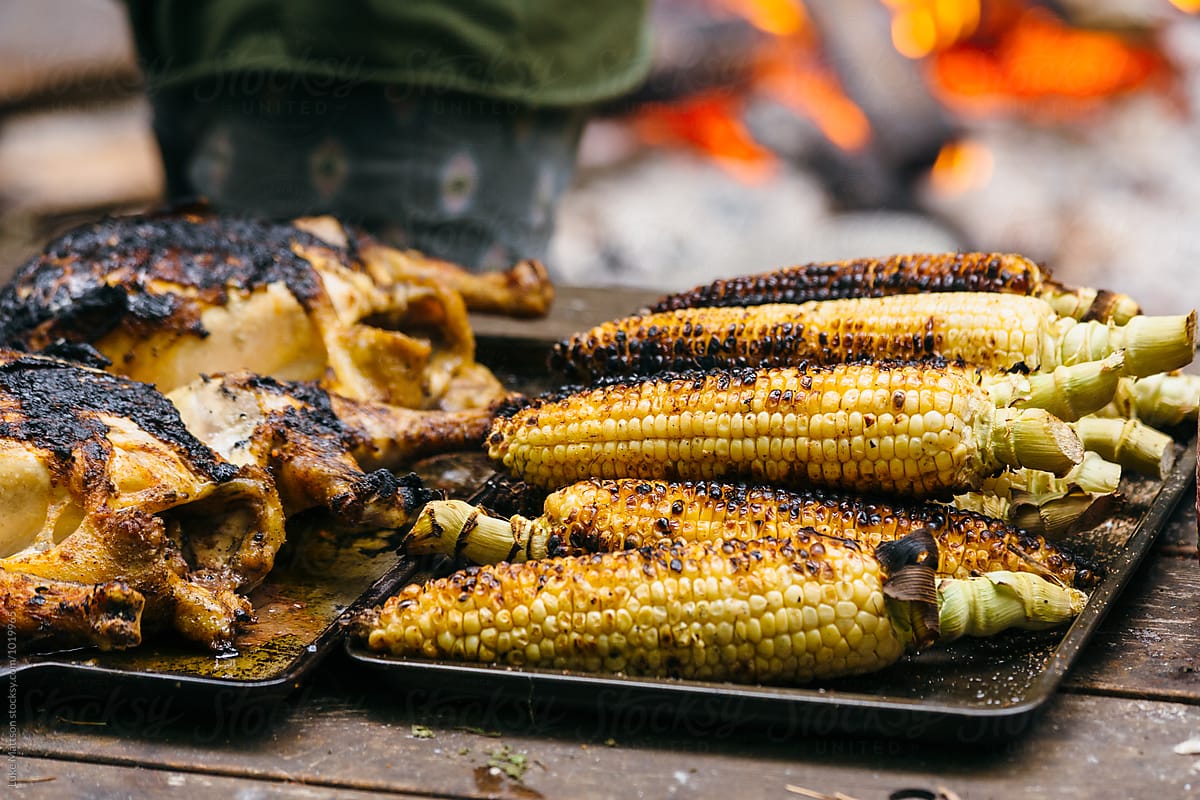 Roasted Corn And Chicken On Picnic Table Near Fire Pit By Luke Mattson Bbq Feast