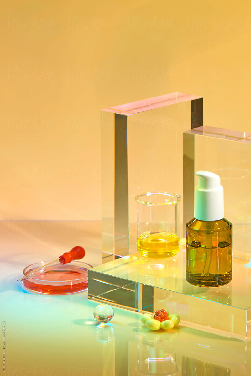 Natural cosmetic products in white packaging with laboratory glassware