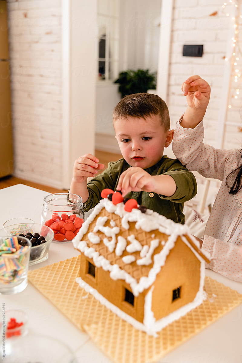 Children  decorating Gingerbread house