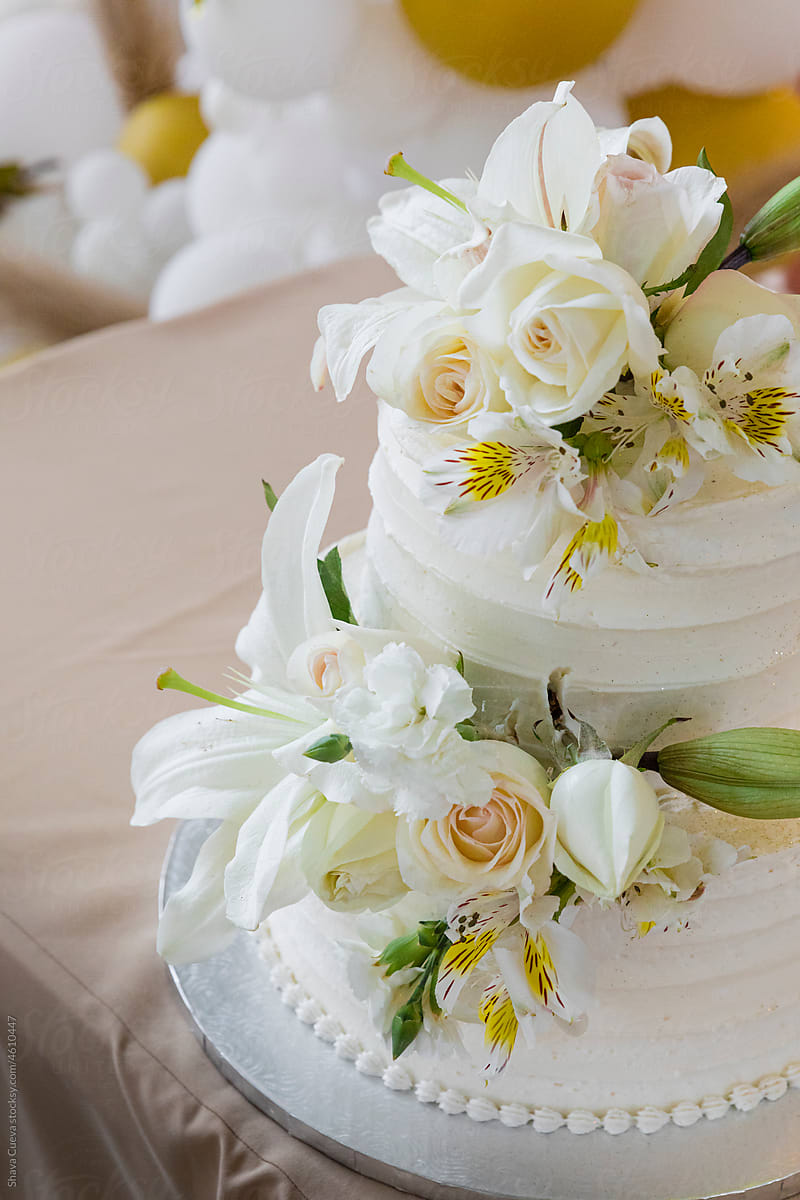 Wedding cake with white flowers on it