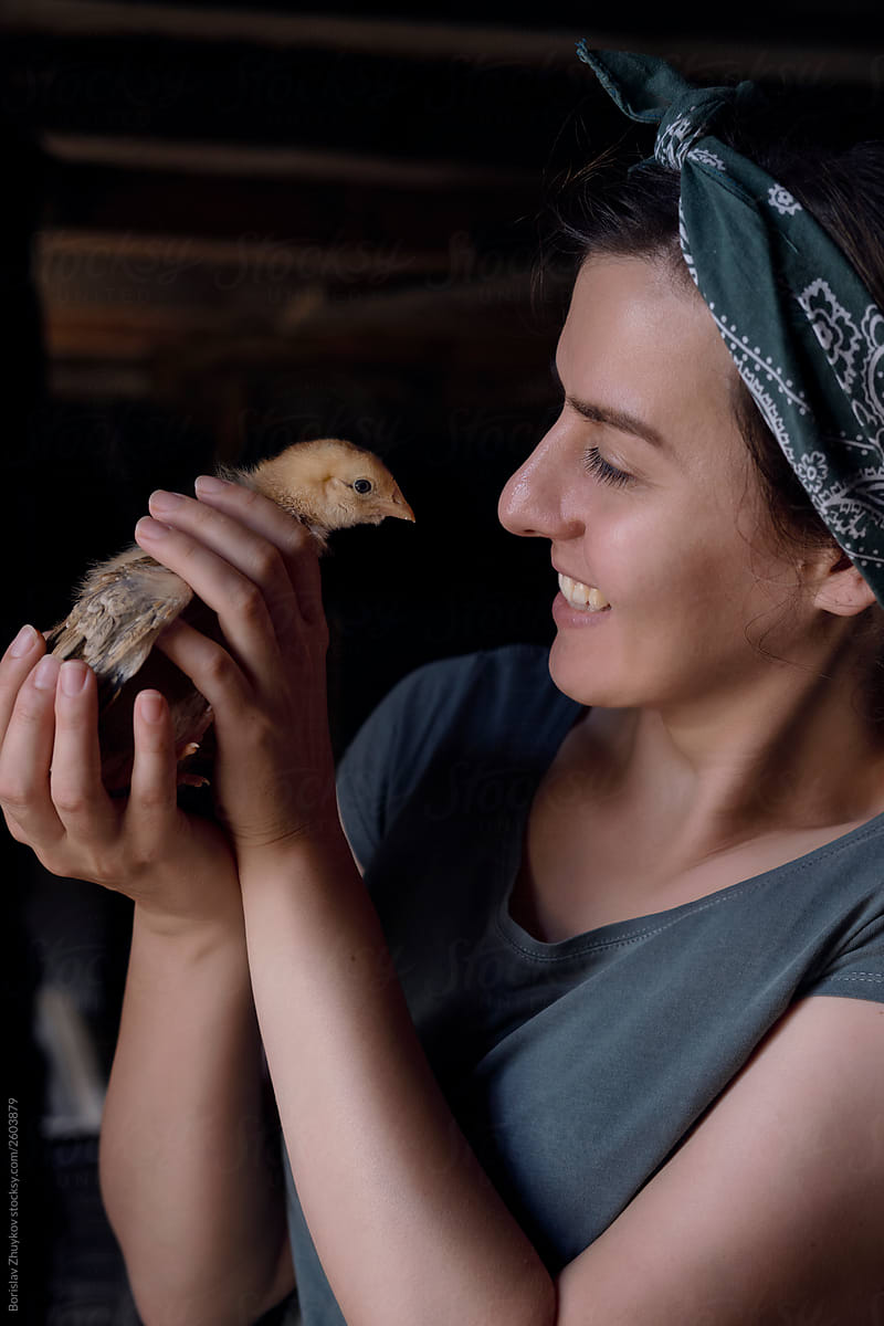 Woman and baby chicken