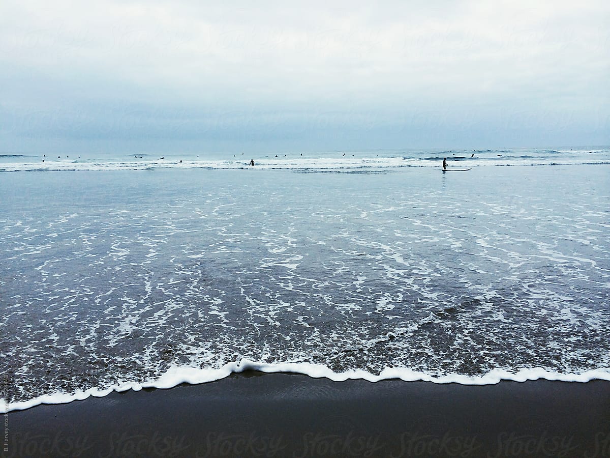 Surfers On The Ocean By Branden Harvey Stories
