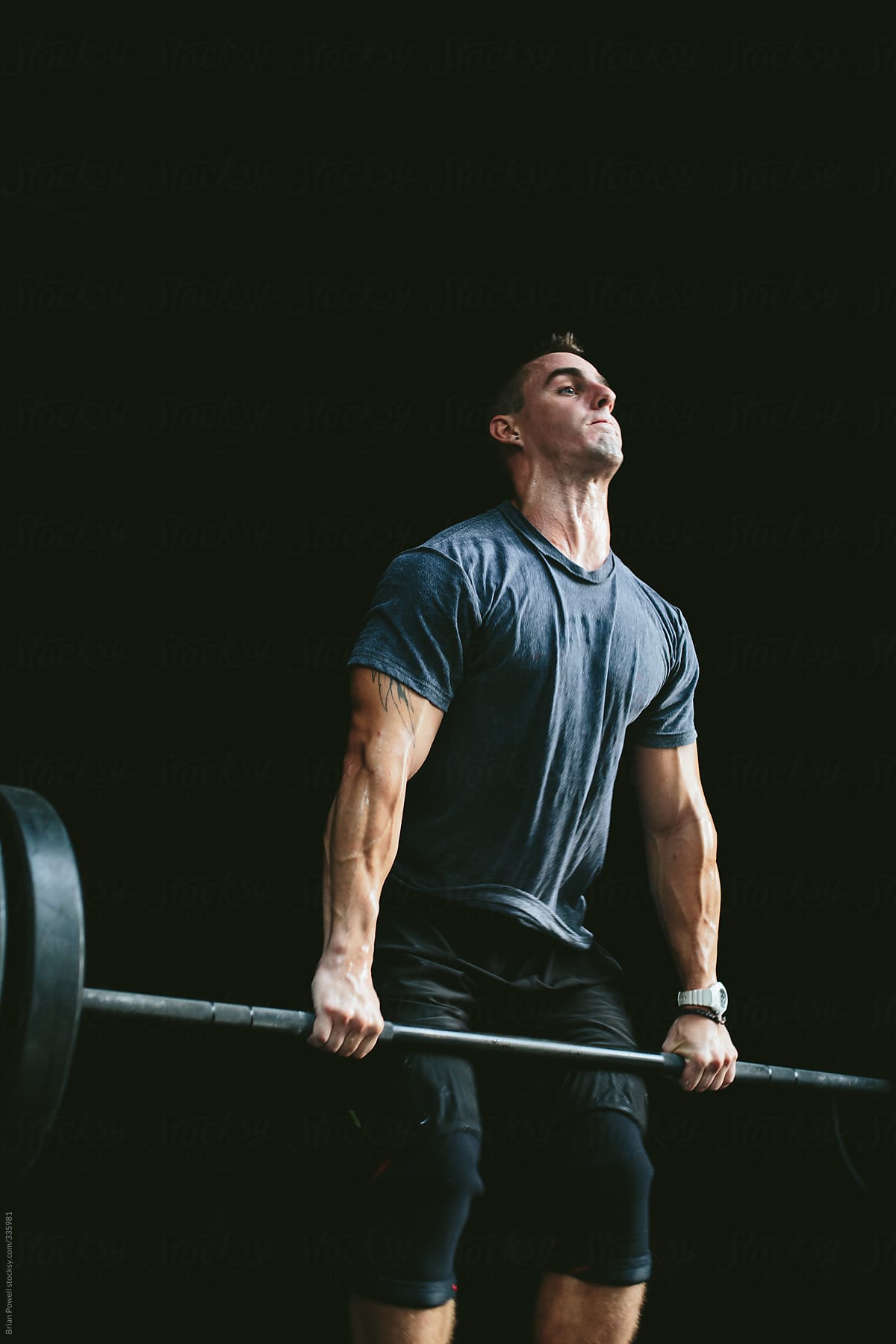 man doing Olympic clean-and-jerk lifting