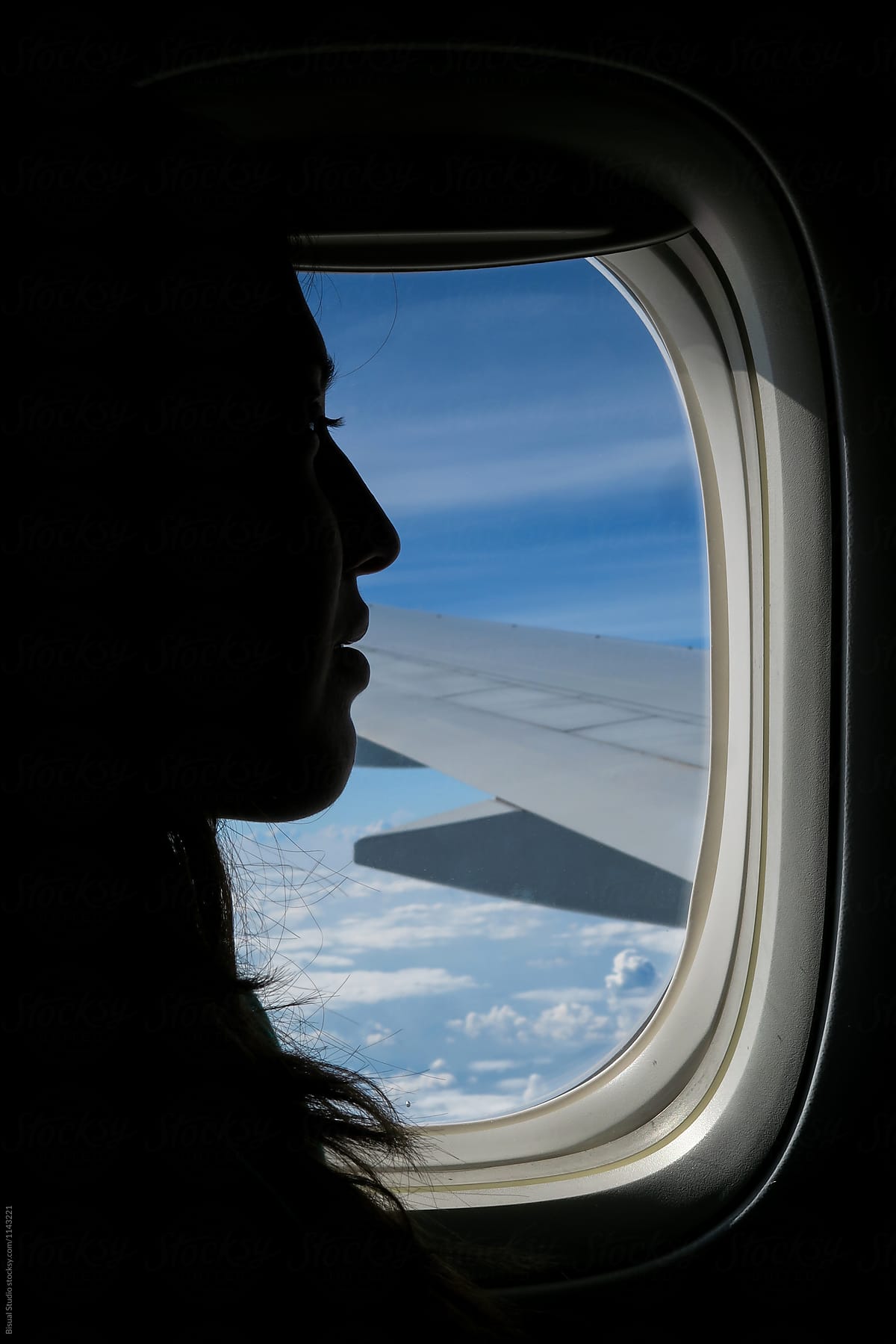 Passenger in flying airplane